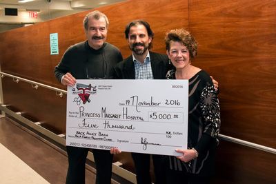 We raised $5,000.00 so that Dr. Antonio Finelli continues his Prostate Research Clinic. We had such an overwhelming response from the community. We could not have done it without our sponsors, guests,staff, clients, and volunteers. Tony and Mary with the 'big cheque'!
