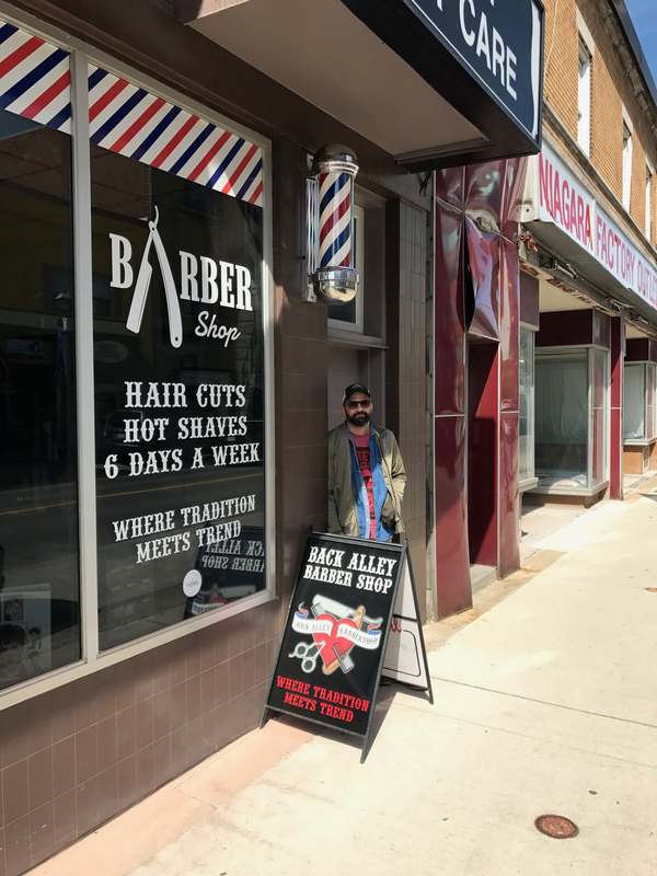 Rob in front of Back Alley Barber Shop in Niagara Falls Ontario, old school barber shop